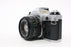 Canon AE-1 Program 35mm SLR Camera with 50mm f/1.8 FD Lens