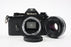 Nikon EM 35mm Camera with 50mm f/1.8 E Series Lens