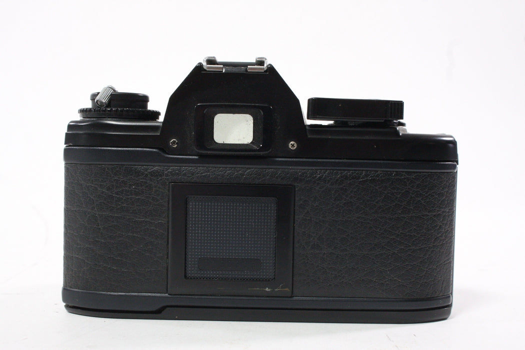 Nikon EM 35mm SLR Camera with 50mm f/1.8 E Series Lens