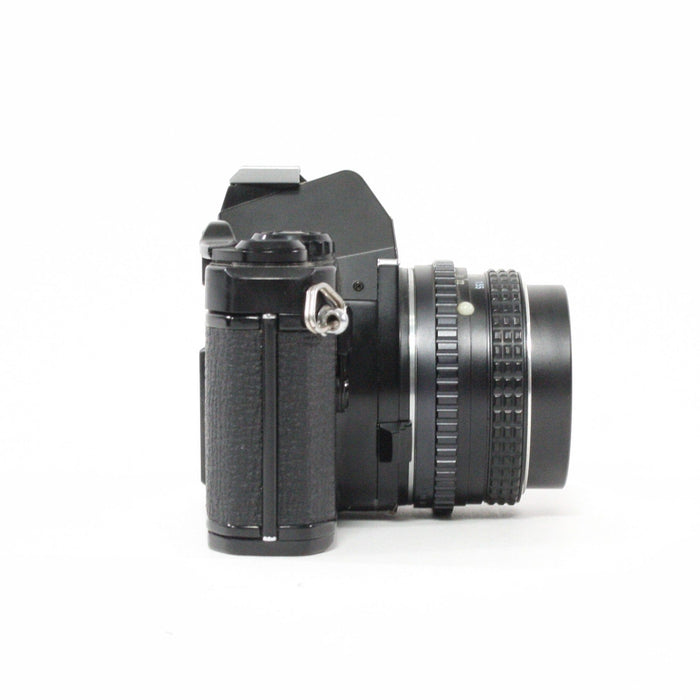 Pentax MV1 with a 50mm f/2 lens.