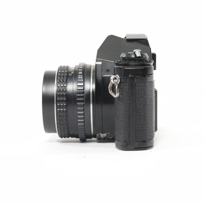 Pentax MV1 with a 50mm f/2 lens.