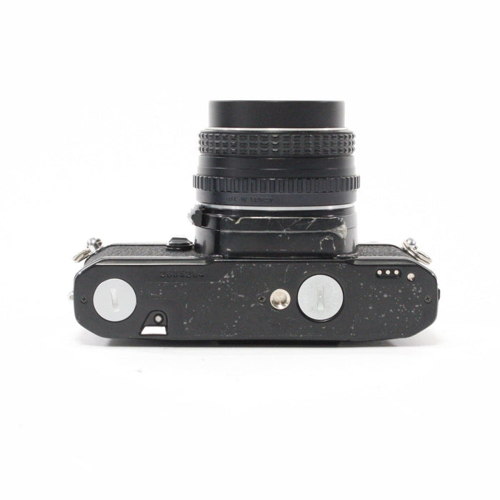 Pentax MV1 with a 50mm f/2 lens.