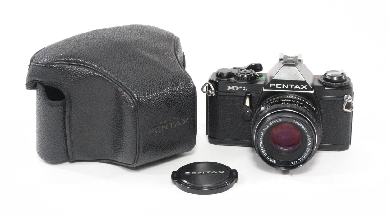 Pentax MV1 with a 50mm f/2 lens.