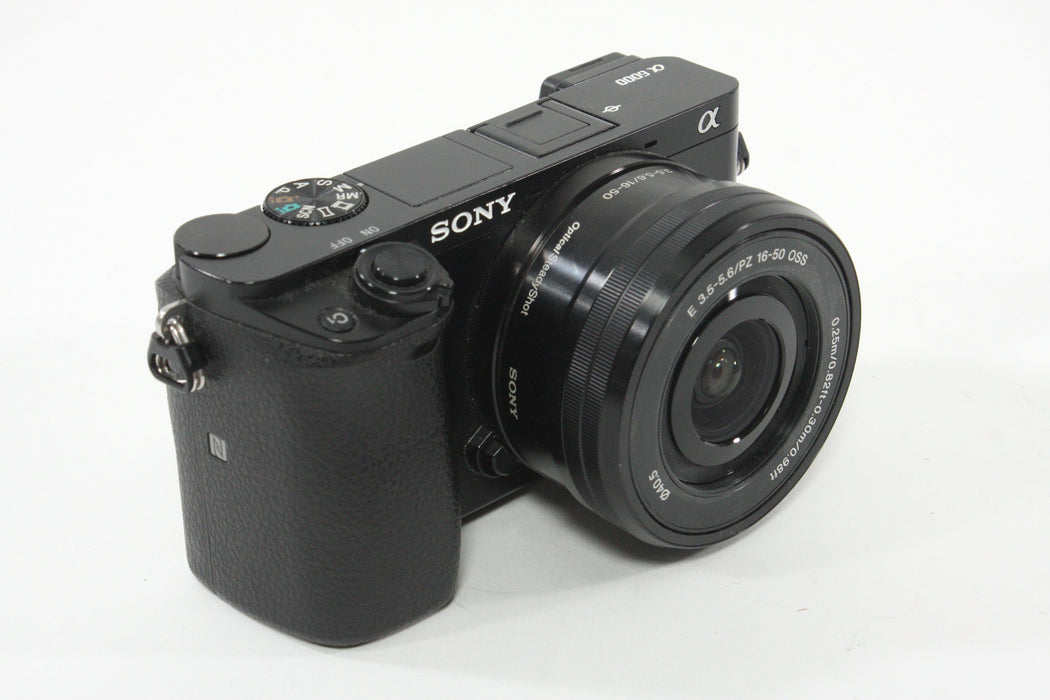 Sony a6000 w/16-60mm F3.5-5.6 Lens + SmallRig Cage and Battery Grip - Shutter Count 7307