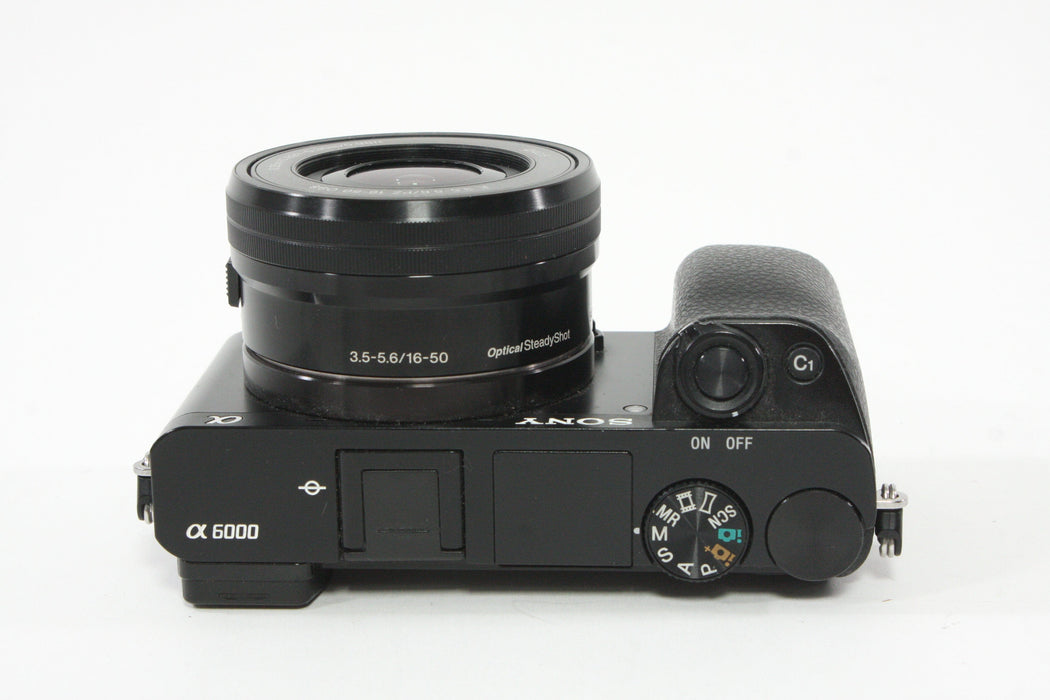 Sony a6000 w/16-60mm F3.5-5.6 Lens + SmallRig Cage and Battery Grip - Shutter Count 7307