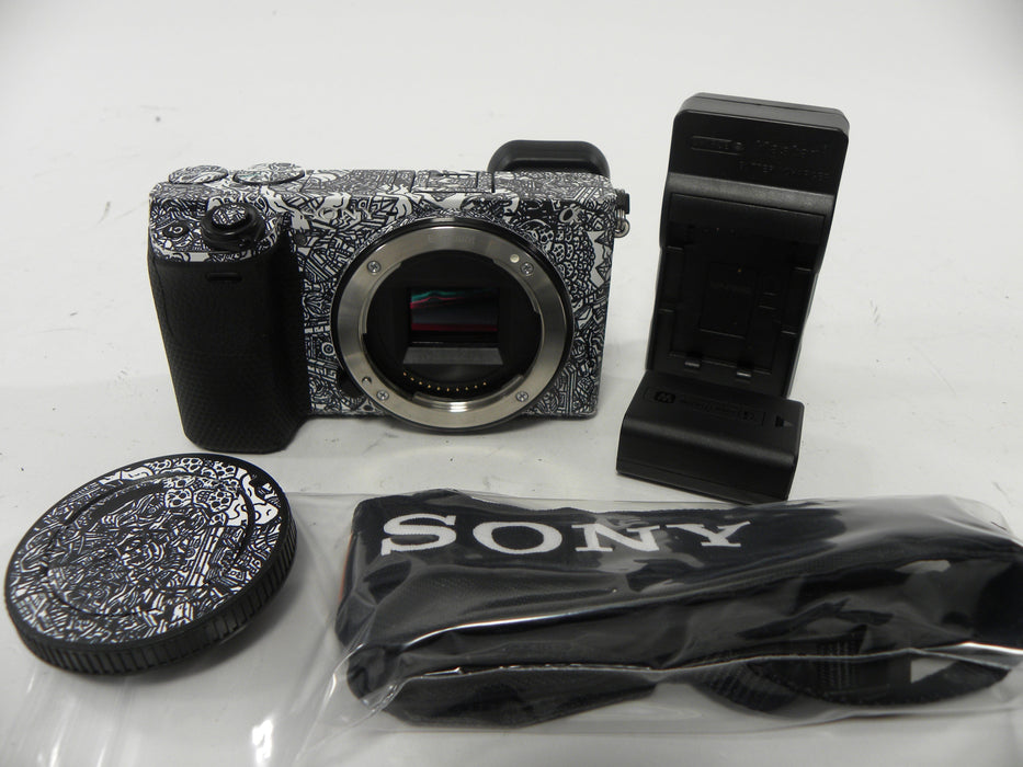 Sony a6400 24.2mp Mirrorless Digital camera Body Only  w/Skin Shutter Ct. 5,061